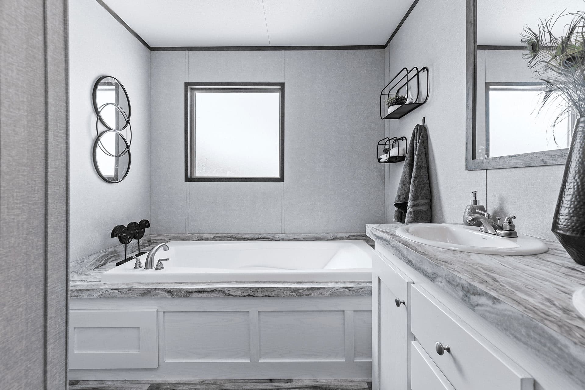 The cuatro 18x76 bathroom home features