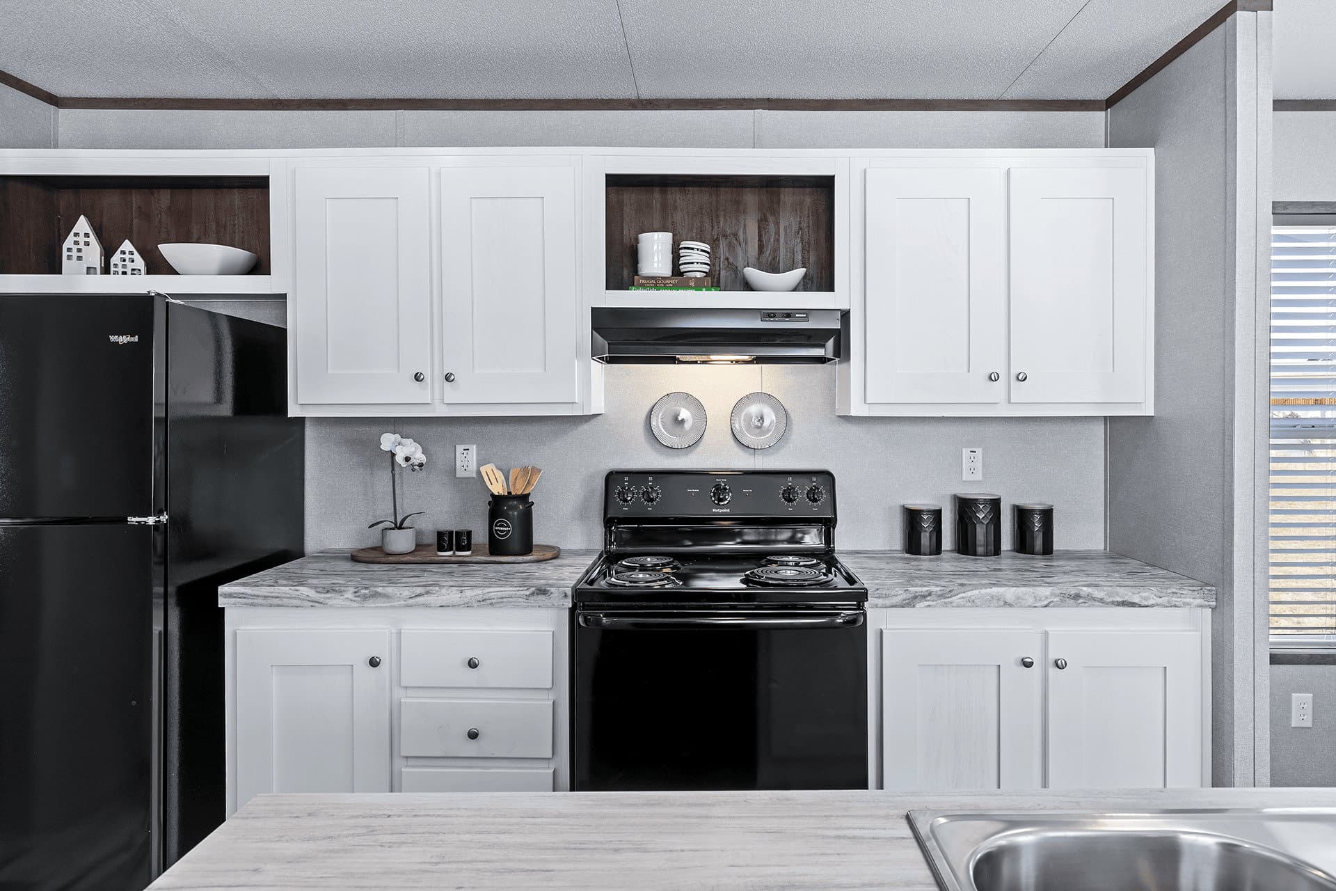 The cuatro 18x76 kitchen home features