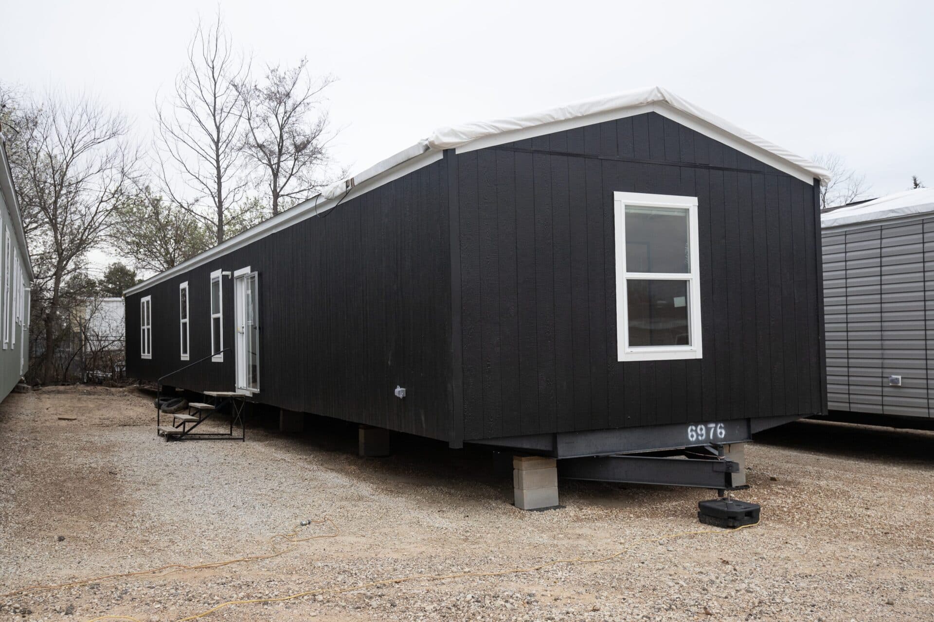 Atlantis 16x76 hero, elevation, and exterior home features